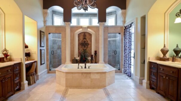 Buckingham primary bath soaking tub framed by columns
