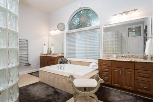 Brookridge primary bath with soaking tub and arched window