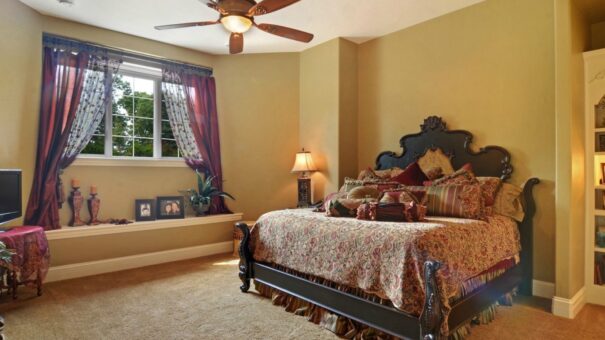 Buckingham primary bedroom with carved wood bed