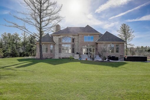 Wildwood rear elevation with stone exterior and lawn