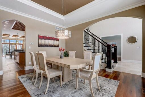 Ridgeview dining room with tray ceiling and chandelier