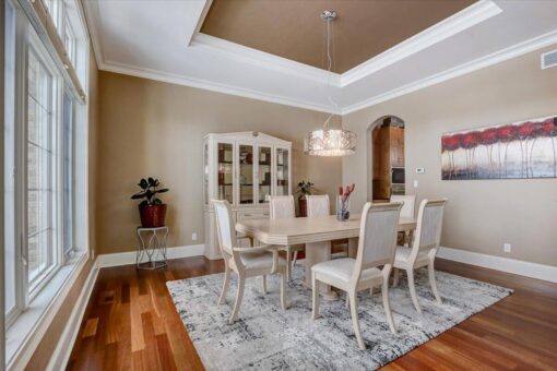 Ridgeview dining room with hutch and chandelier