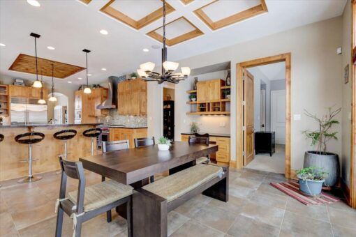 Ridgeview breakfast area with coffered ceiling and chandelier