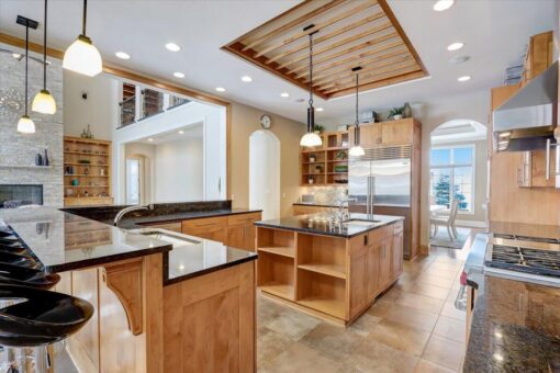 Ridgeview kitchen with wood ceiling detail and islands