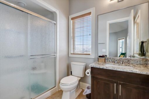 Ridgeview bathroom with glass shower and dark vanity
