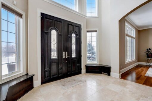 Ridgeview foyer with dark wood entry doors and window