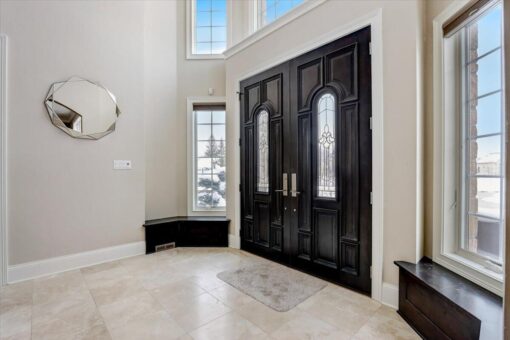 Ridgeview foyer with dark wood double entry doors