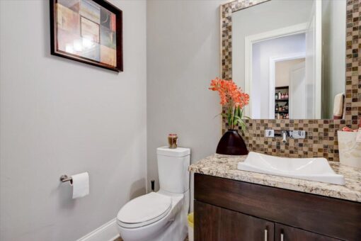 Ridgeview powder room with mosaic backsplash