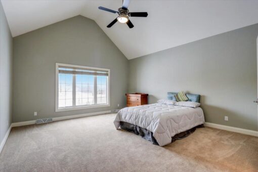 Ridgeview bedroom with gray walls and vaulted ceiling