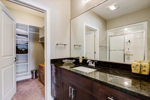 Ridgeview bathroom with dark vanity and granite top