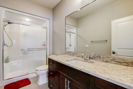 Ridgeview bathroom with granite vanity and tub