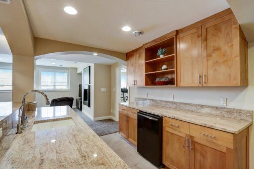 Ridgeview lower-level kitchen with maple cabinetry
