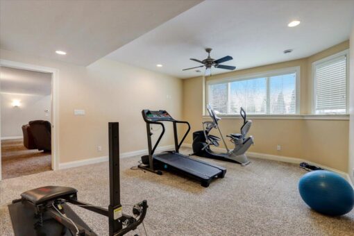 Ridgeview lower-level exercise area with windows