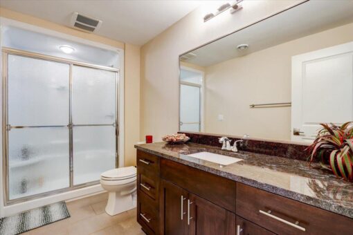 Ridgeview bathroom with glass shower and granite vanity