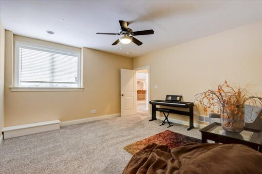 Ridgeview lower-level room with ceiling fan