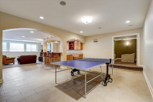 Ridgeview lower-level game room with ping-pong table