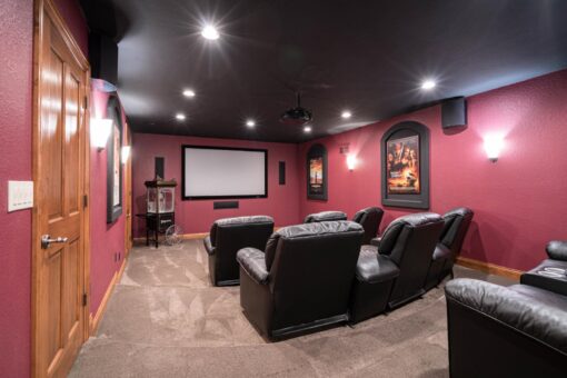 Brookridge lower-level home theater with red walls