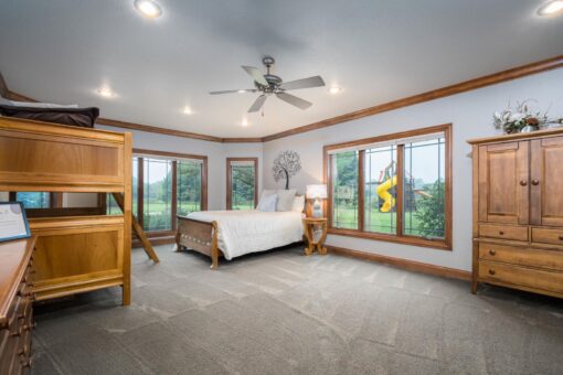 Brookridge lower-level bedroom with walk-out windows