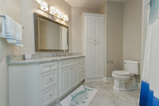 Bradon bathroom with white vanity and linen cabinet