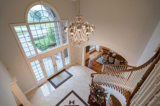 Brookridge two-story foyer with chandelier viewed from above