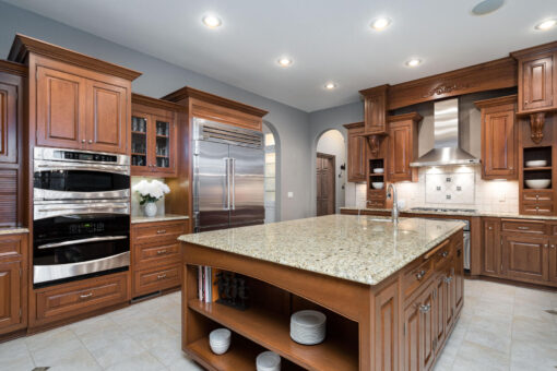 Brookridge kitchen with cherry cabinetry and granite island
