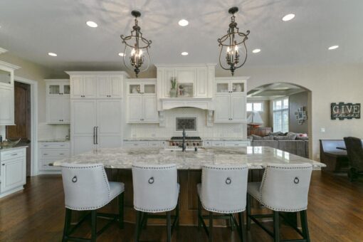 Bradon white kitchen with island seating and lantern pendants