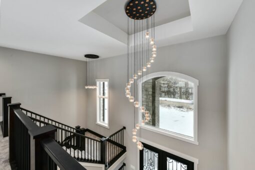 Hawks Ridge loft with spiral pendant chandelier over the stairs