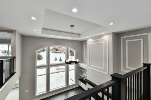 Hawks Ridge loft with tray ceiling and arched window