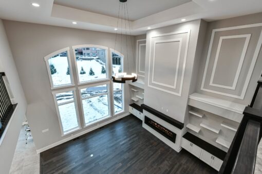 Hawks Ridge great room fireplace wall with paneled detail