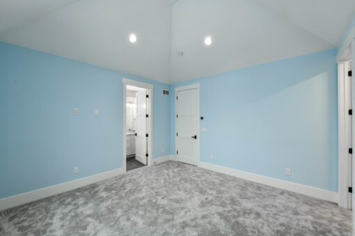 Hawks Ridge bedroom with light blue walls and closet