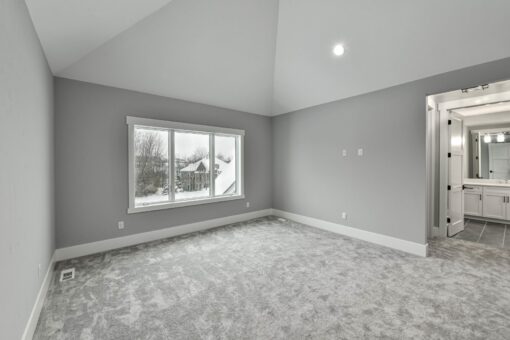 Hawks Ridge bedroom with window and bath entry