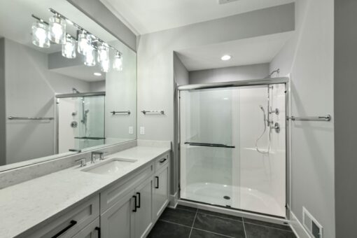 Hawks Ridge bathroom with white vanity and glass shower