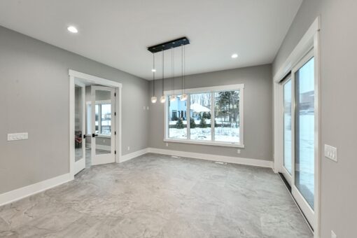 Hawks Ridge breakfast area with linear chandelier and windows