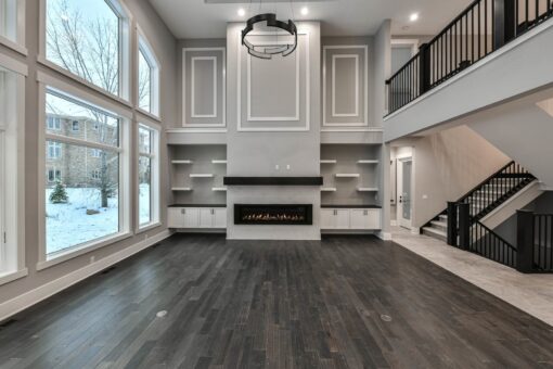 Hawks Ridge two-story great room with linear fireplace and balcony