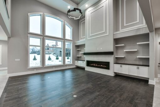 Hawks Ridge great room with arched windows and linear fireplace