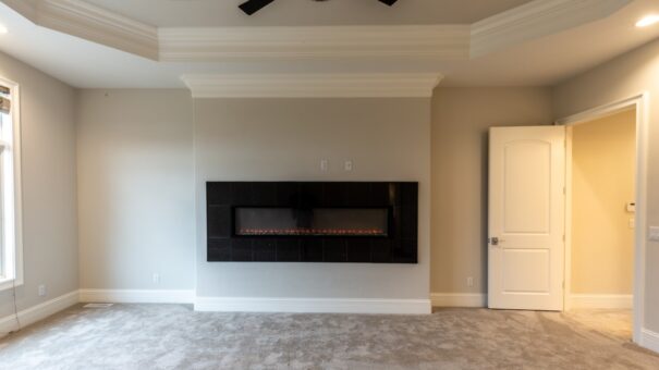 Davidson primary bedroom with linear fireplace
