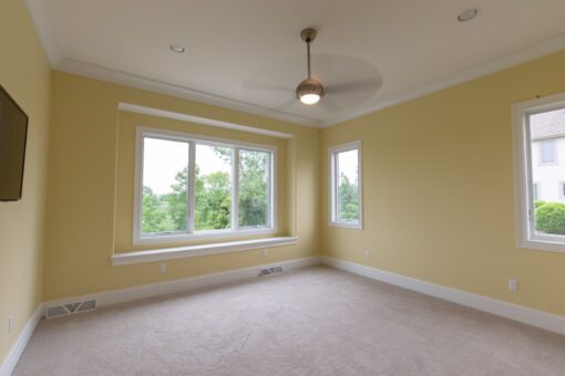 Ravenna bedroom with large window and ceiling fan