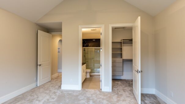 Davidson bedroom with walk-in closet and bath entry