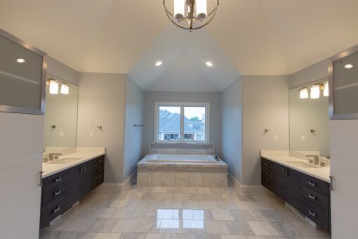 Ravenna primary bath with tub beneath a window