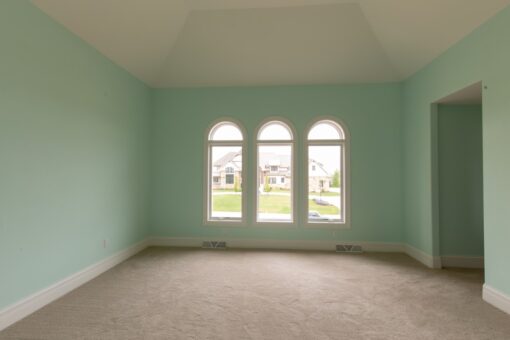 Ravenna bedroom with arched windows and mint walls