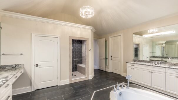 Davidson primary bath with tub and walk-in closet entry