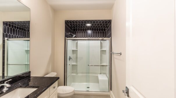 Davidson glass shower with black tile accent