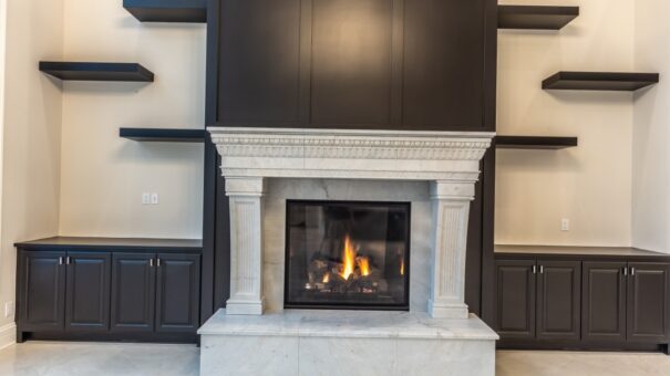 Davidson cast stone fireplace with dark paneling