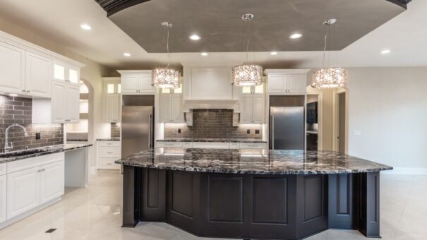 Davidson kitchen with dark island and stainless range wall