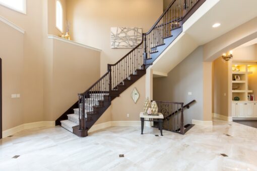 Summerhill foyer staircase with dark wood railing