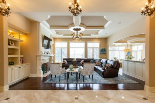 Summerhill great room with tray ceiling and chandelier