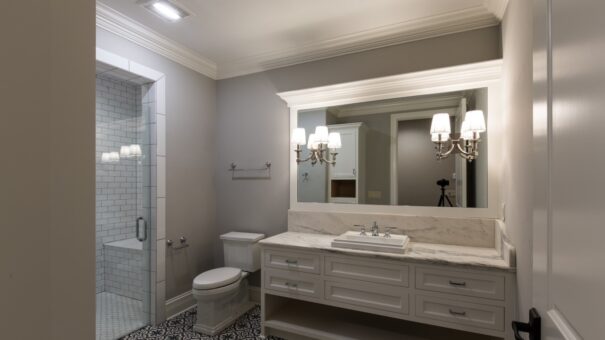 Bella Haven bathroom with white vanity and patterned floor