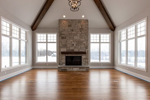 Birchwood hearth room with stone fireplace and timber beams