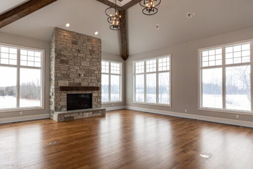 Birchwood hearth room with stone fireplace and vaulted ceiling