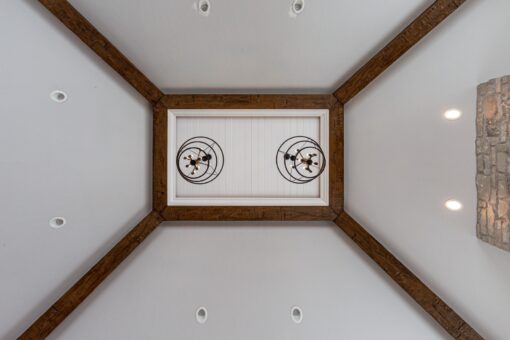 Birchwood ceiling with wood beam detail